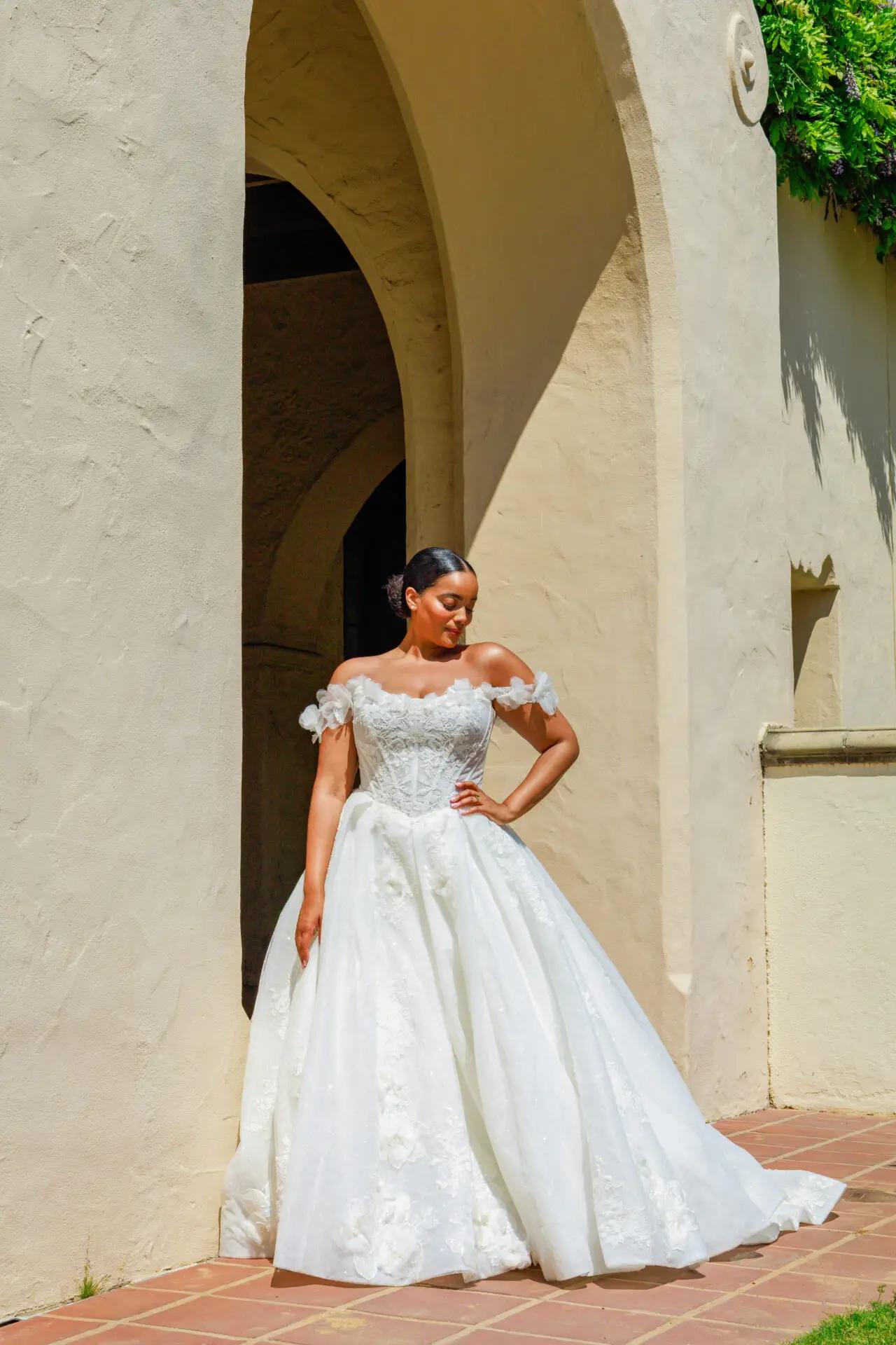 Model wearing a white gown by Martina Liana