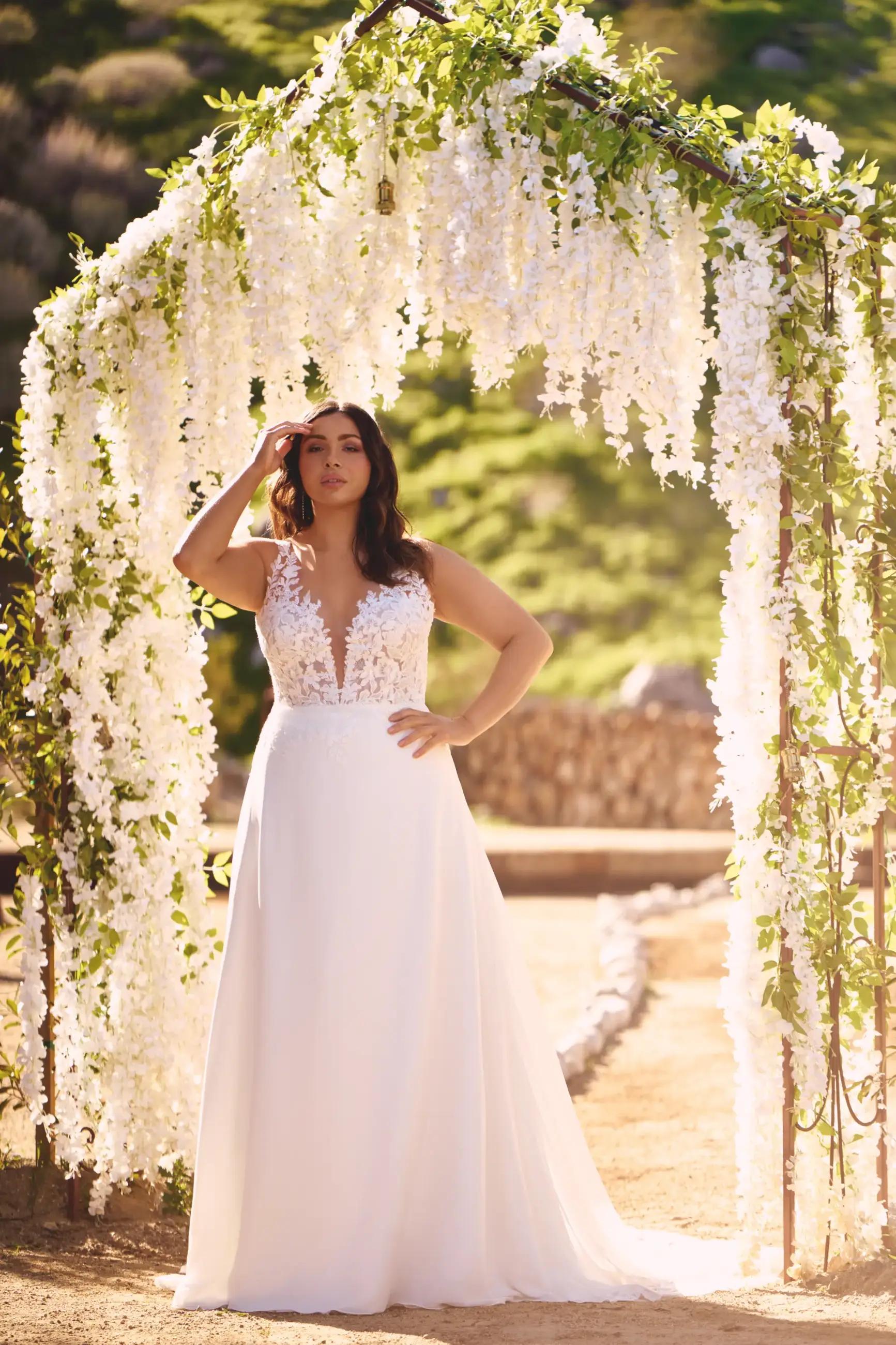 Model wearing a white gown by Lillian West